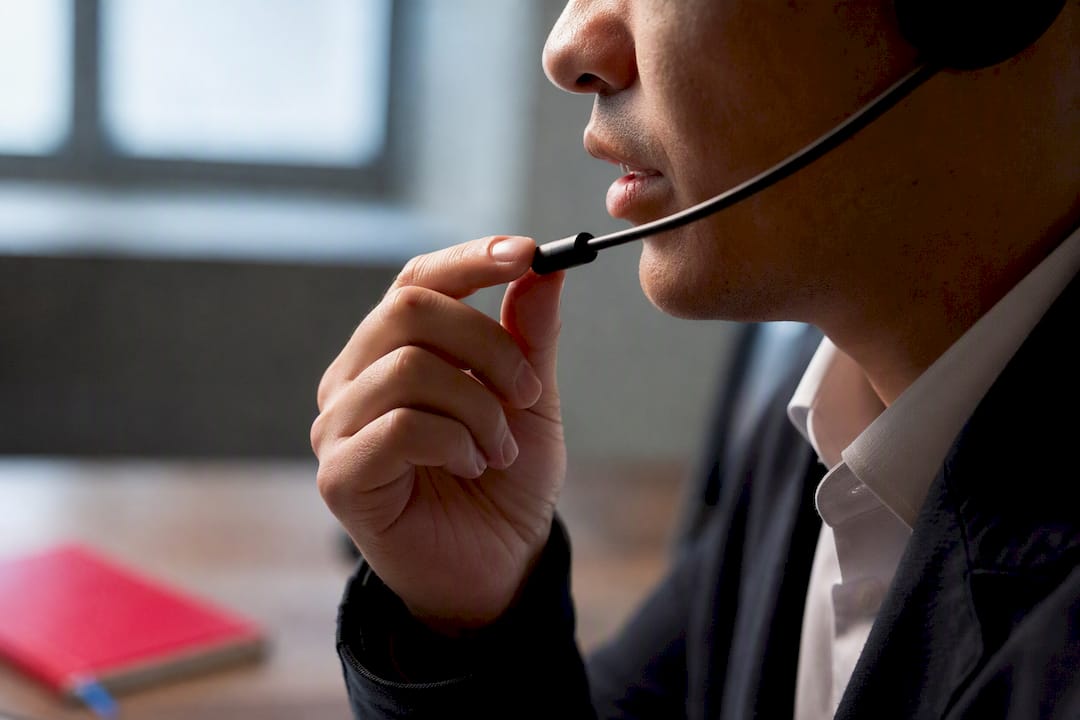 Hand checking headset microphone distance